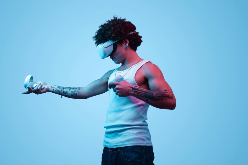 Focused fit Hispanic guy playing video game in VR headset